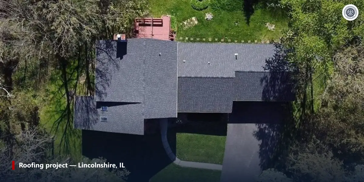 Aerial photo of a finished asphalt shingle roof surrounded by trees on a completed Lincolnshire, Illinois roofing project