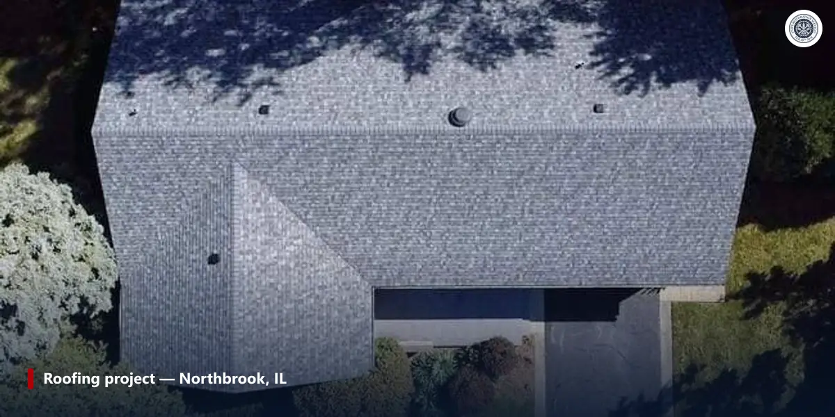 Aerial view of a completed asphalt shingle roof in Northbrook, Illinois showing vents and pipe penetrations