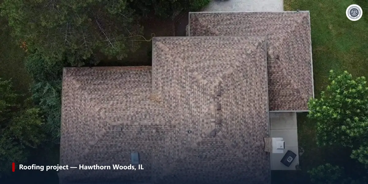 Aerial photo of a hip roof with brown shingles after a roof replacement in Hawthorn Woods, IL