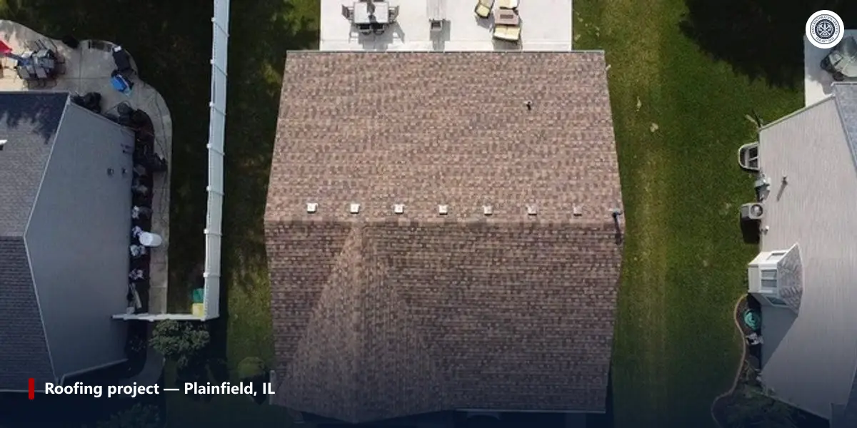 Aerial view of a completed asphalt shingle roofing project in Plainfield, Illinois