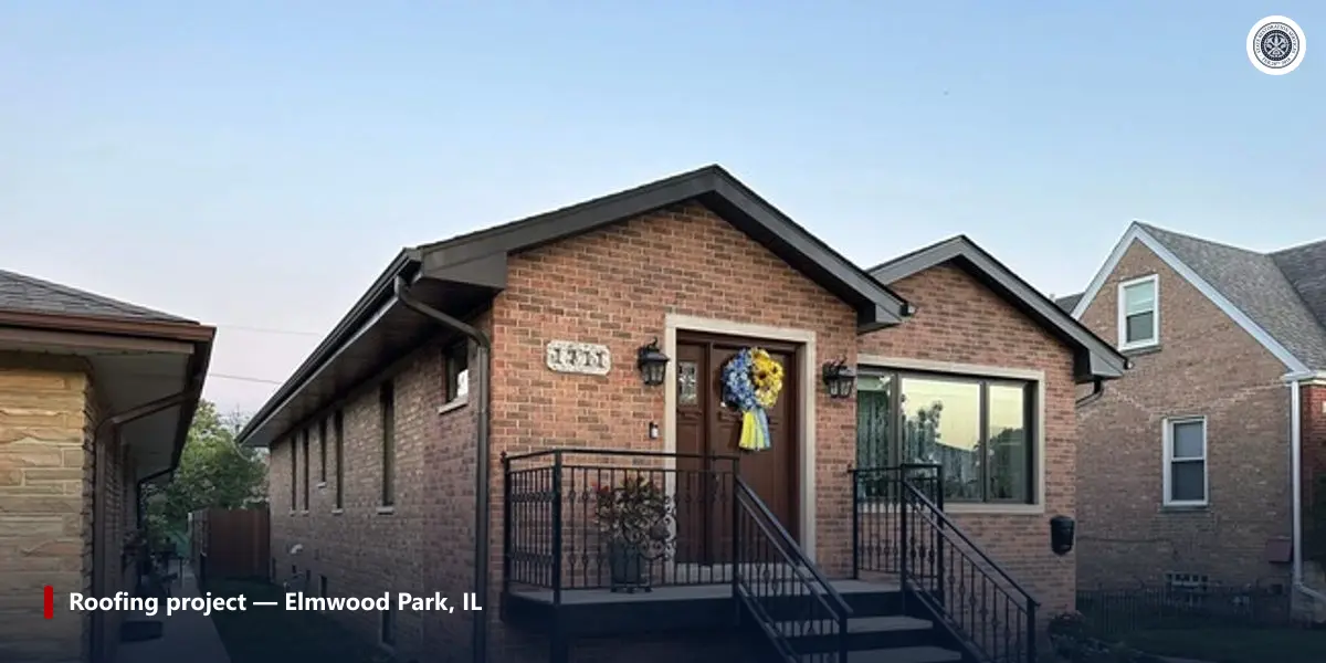 Brick bungalow with a dark downspout that jogs under the eave through two elbows before it runs down the wall
