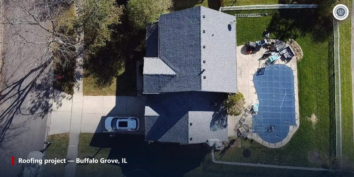 Aerial view of a completed shingle roof in Buffalo Grove, IL, showing the lower garage and entry roof sections