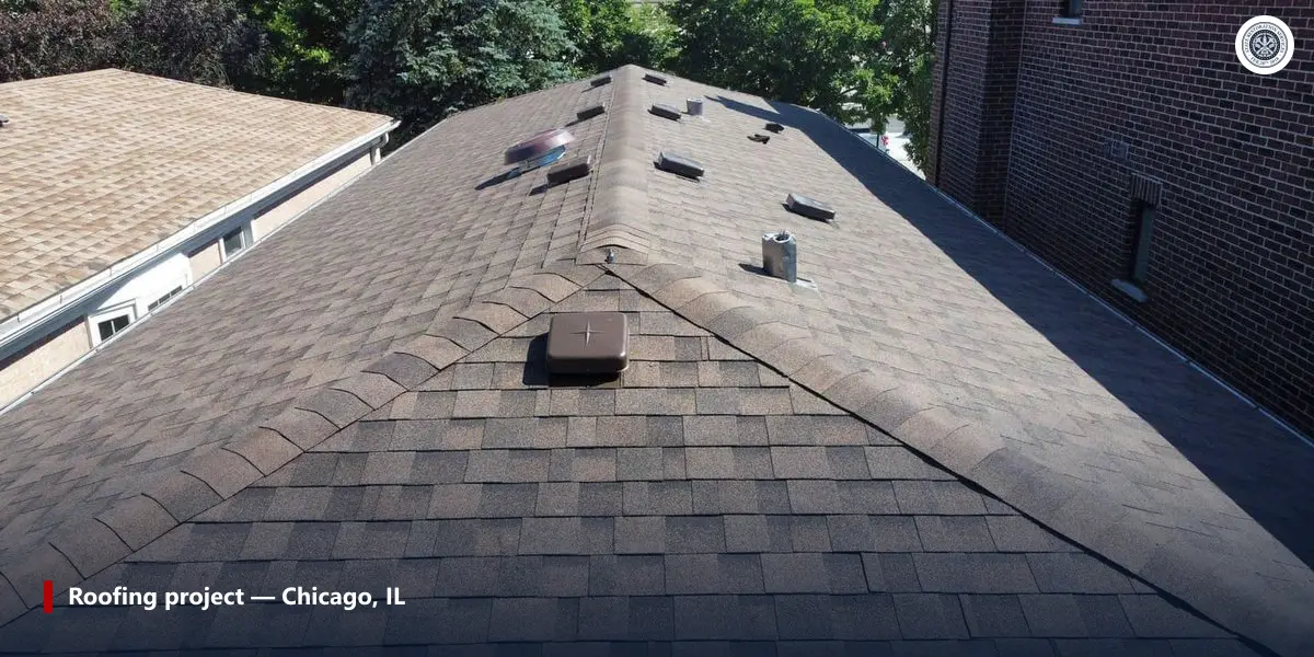 Aerial view of a clean asphalt shingle roof after a completed roofing project in the Chicago suburbs