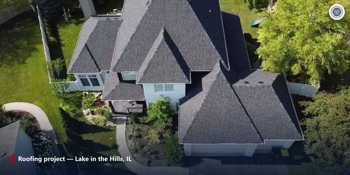 Completed asphalt shingle roof replacement on a two-story home in Lake in the Hills, Illinois