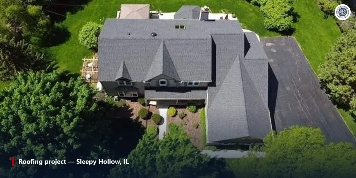 Aerial view of a completed State Restoration Services shingle roof on a large home in Sleepy Hollow, Illinois