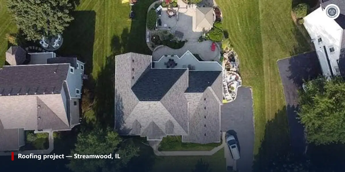 Aerial view of a completed asphalt shingle roof on a house in Streamwood, Illinois