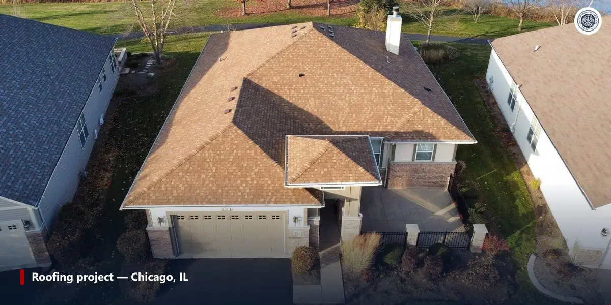 Completed asphalt shingle roof on a Chicago-area home with properly flashed vent pipes