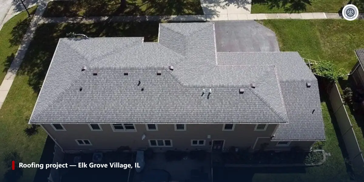 Completed asphalt shingle roof replacement on a two-story home in Elk Grove Village, Illinois