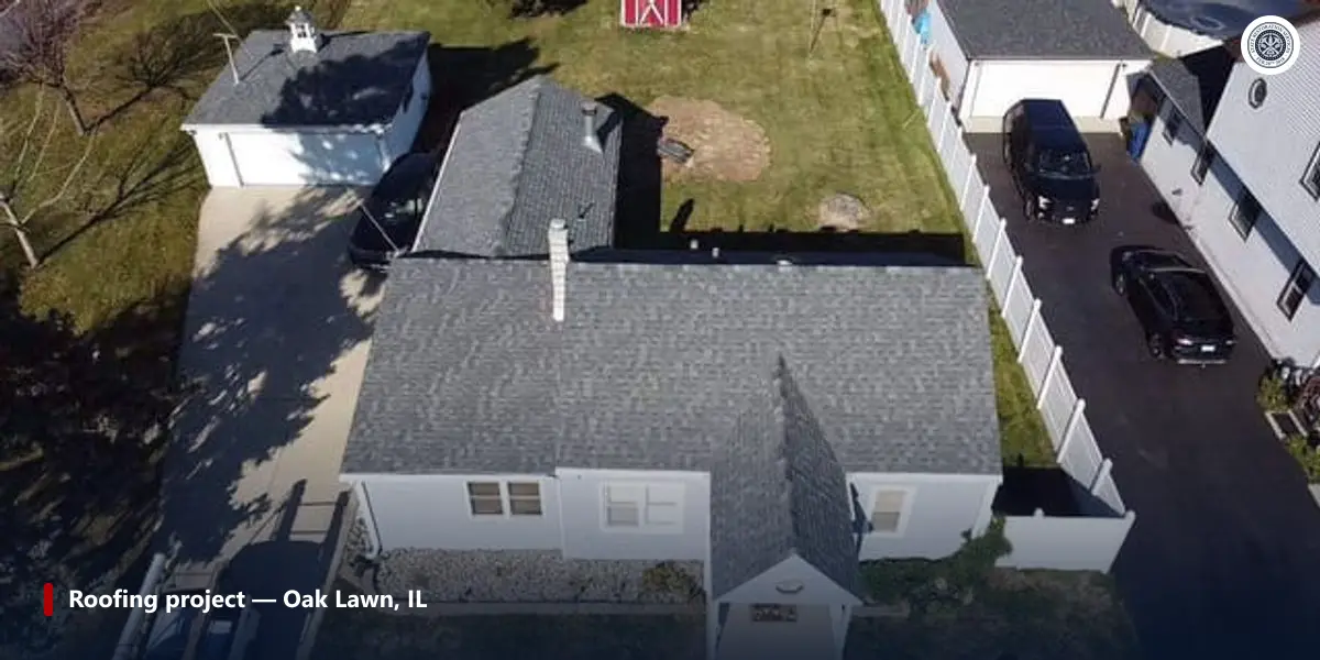 Aerial view of a finished asphalt shingle roof replacement on a house in Oak Lawn, Illinois