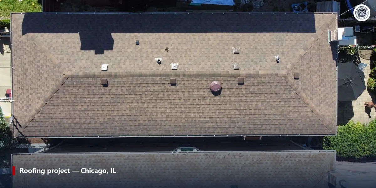 Aerial view of a completed roof replacement in the Chicago suburbs showing ridge vents and clean shingle lines