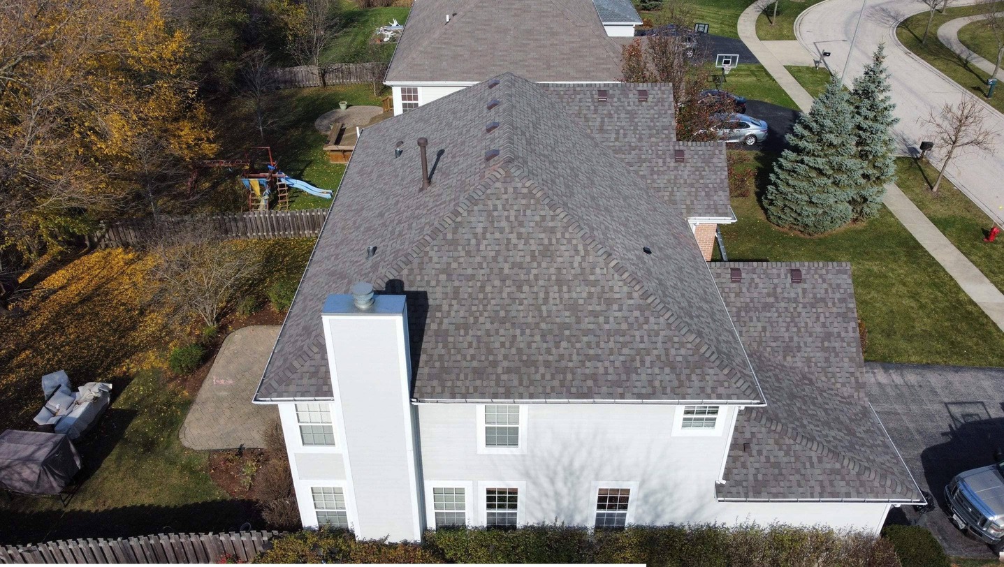 Aerial view of a roof built by State Restoration Services, highlighting excellent craftsmanship and high-quality materials.