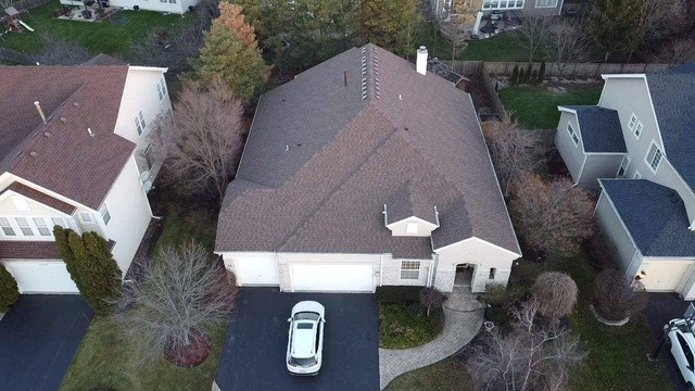 Drone view of the Sunset Brown roof installed by State Restoration Services, capturing the warm tones and expert craftsmanship in the fading light.