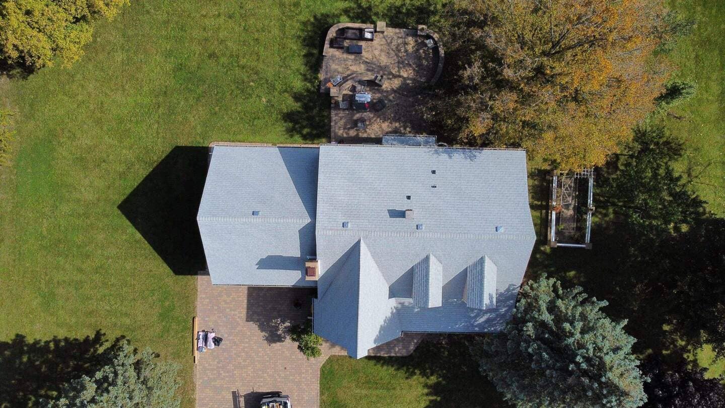 Aerial view of a newly constructed roof by State Restoration Services, showing clean lines and superior craftsmanship.